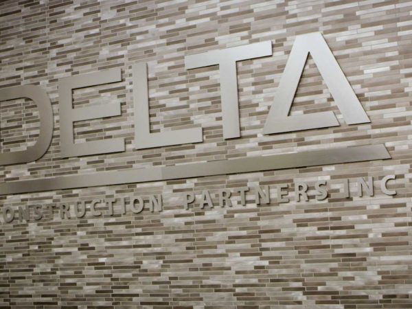 Delta Construction logo on wall