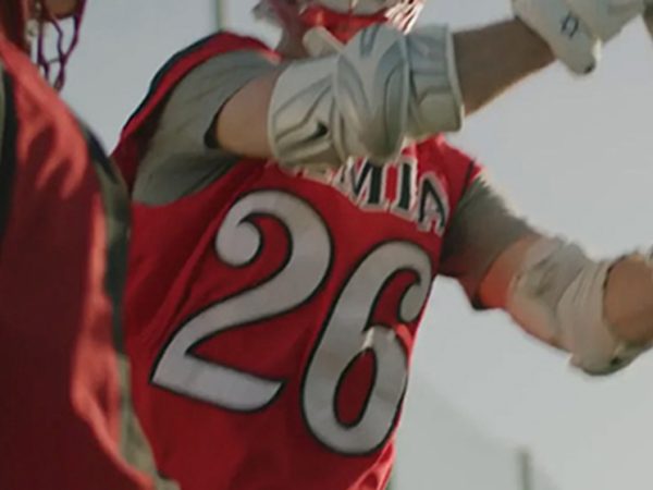 Lacrosse player in red uniform